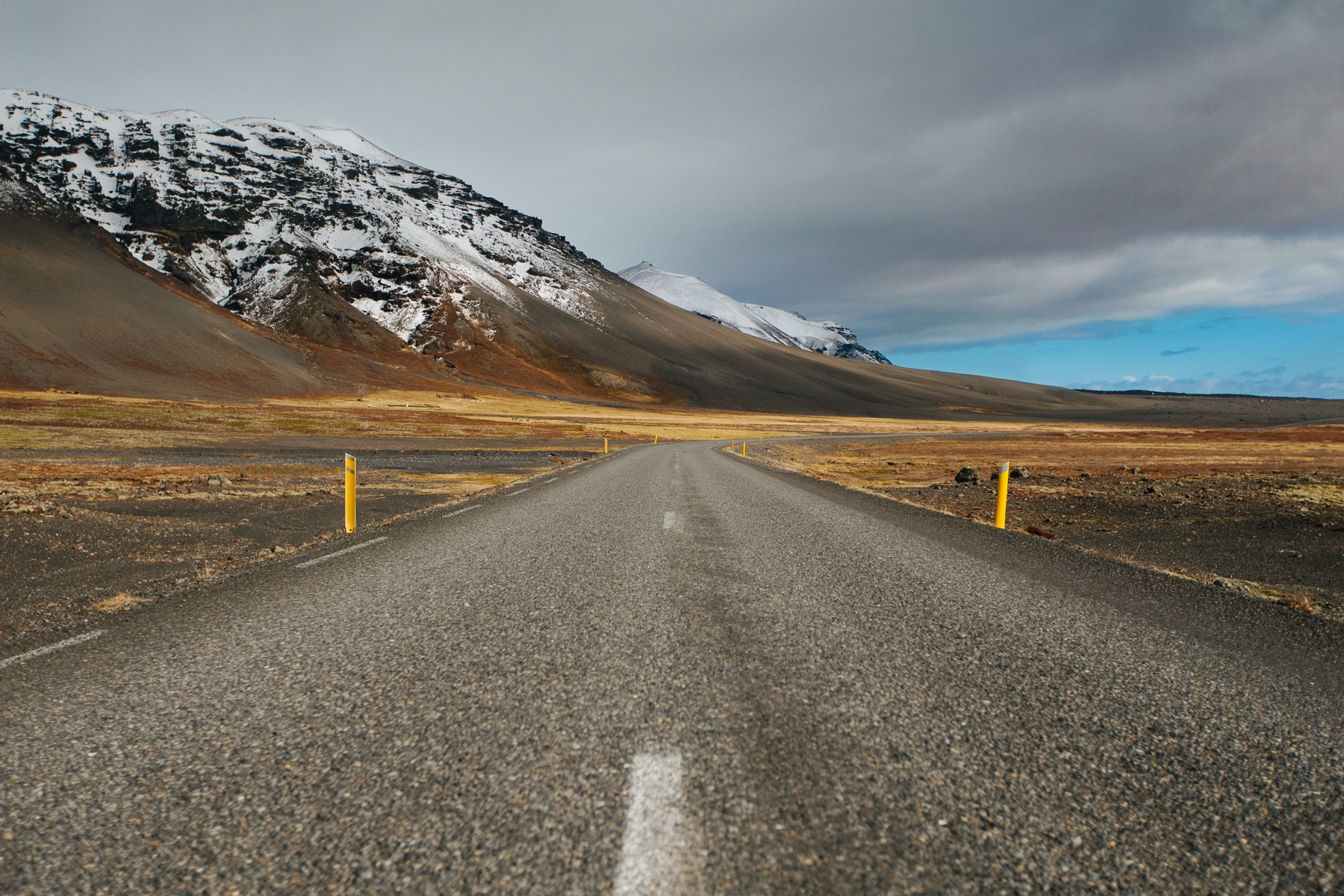A road winding through Icelandic mountains